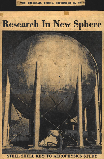 Photo of the giant metal vacuum sphere, a man standing at its base dwarfed by the device, from The Toronto Telegram, September 22, 1950. Photo titled "Research In New Sphere: Steel Shell Key to Aerophysics Study."