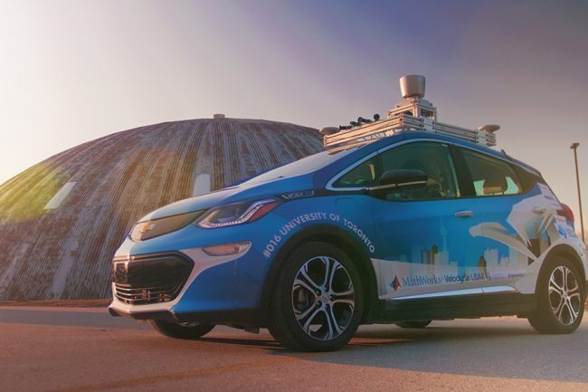 Zeus, a self-driving electric car created by a team of students from U of T Engineering, parked outside the MarsDome at the University of Toronto Institute for Aerospace Studies