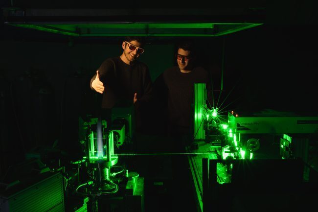 PhD student Yazdan Naderzadeh (left) in the Propulsion and Energy Conversion Lab at UTIAS investigates flames with lasers