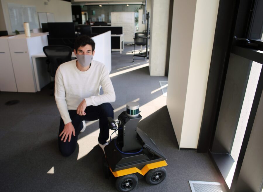 Dr. Hugues Thomas (UTIAS) poses with a small autonomous robot. He and his collaborators created a new method for robot navigation based on self-supervised deep learning