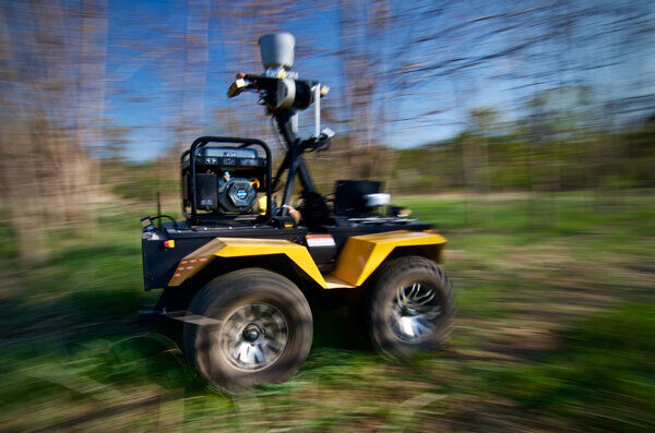 A four-wheeled robot vehicle navigates an off-road route at the Canadian Space Agency offices in Longueuil, Quebec.