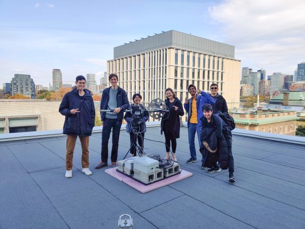 Members of the UTAT Space Systems division gather on the sixth-floor roof of the Bahen Centre with the fully assembled ground station.